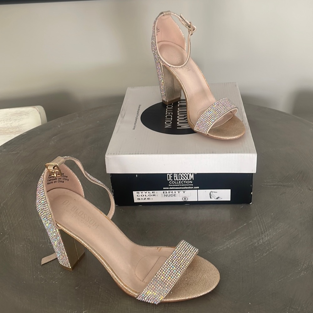Beautiful jeweled sandals. Only wore once for 5 hours. 4 inch heel